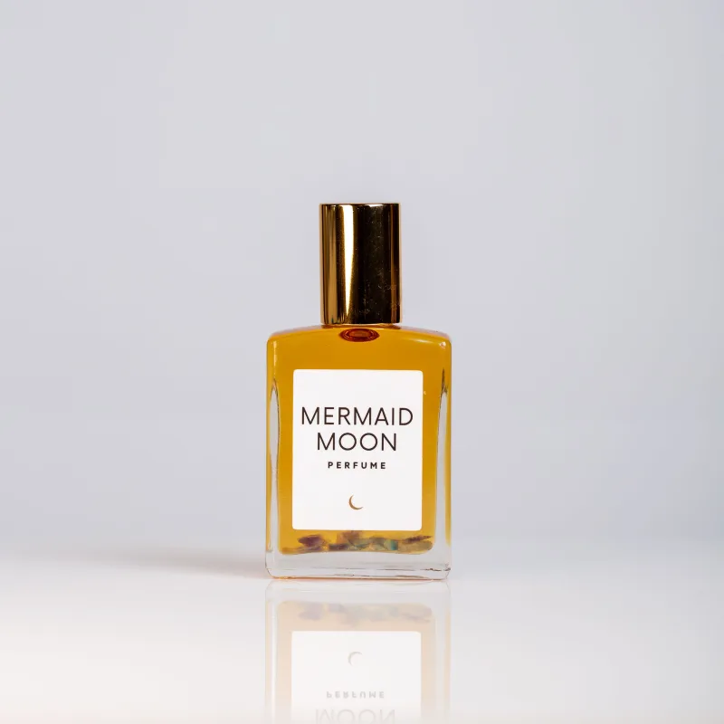 Olivine Mermaid Moon perfume oil with Fluorite crystals